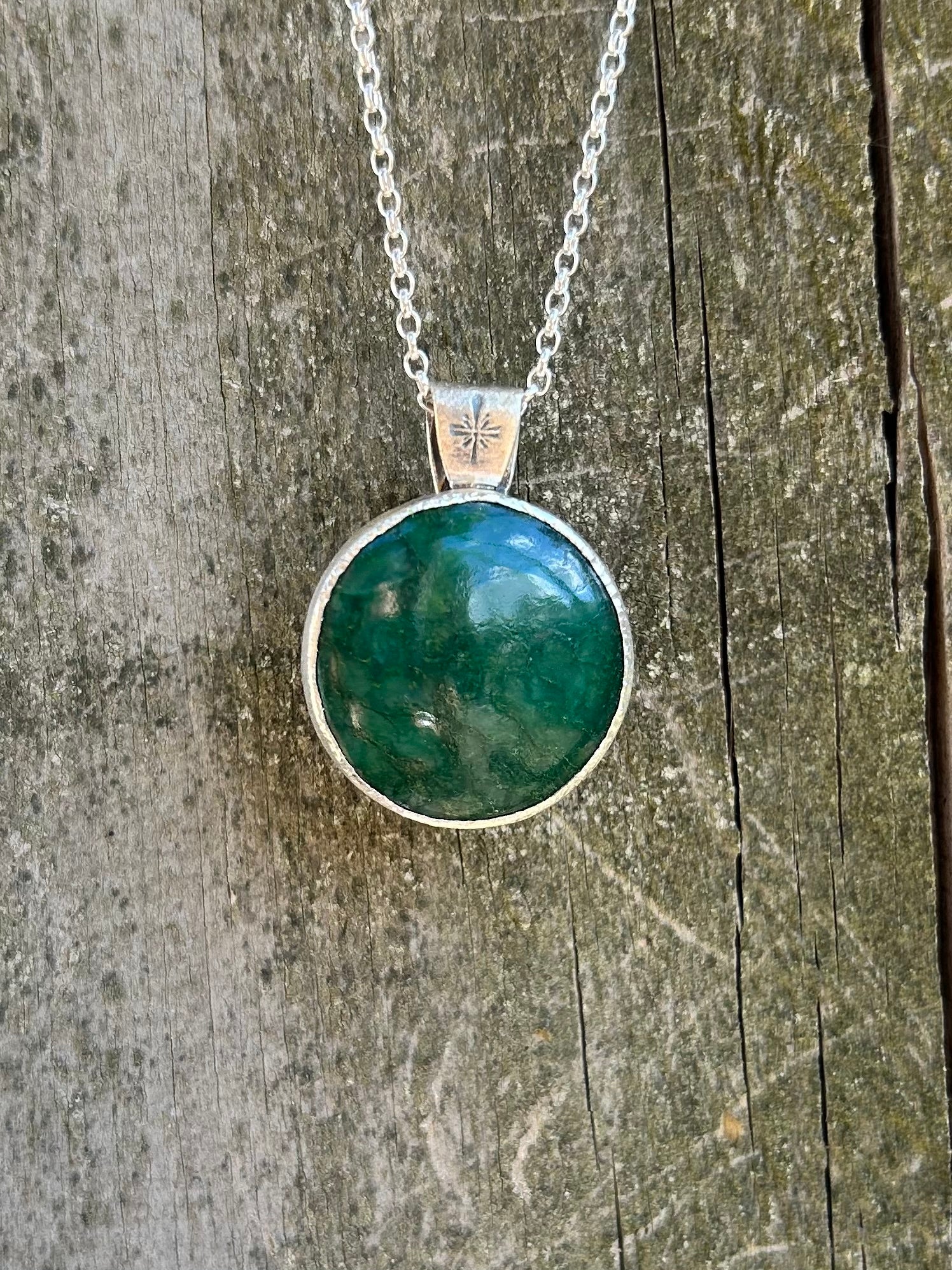 Handmade jade pendant in sterling silver with leaf pattern on reverse
